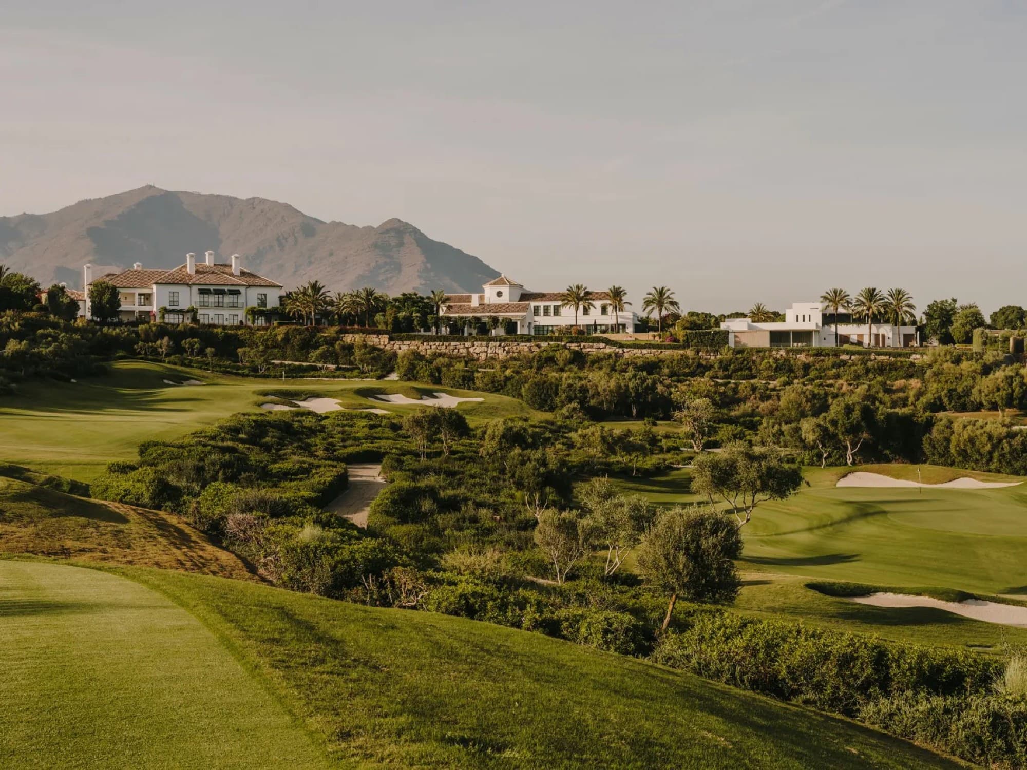 The golf course at Finca Cortesín with the Sierra Bermeja behind