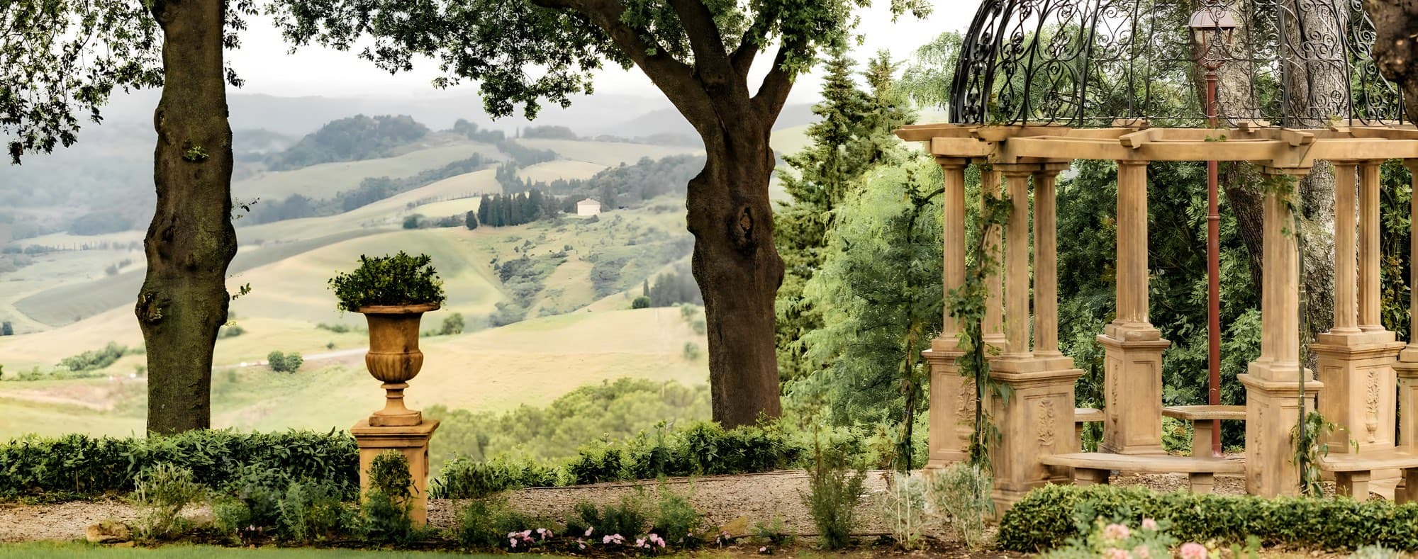 A garden pavilion with the Tuscan hills beyond